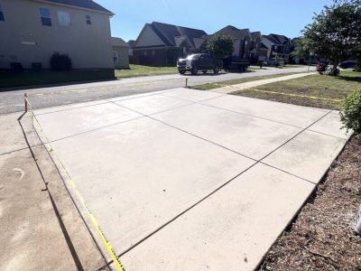 Driving addition parking area with house n background