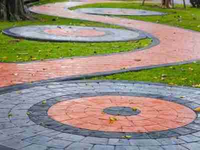 A walkway with circular designs in the middle of it.